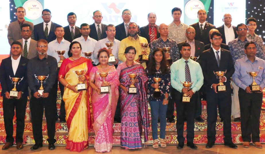 The winners of the 3rd Walton President Cup Golf Tournament with the guests and officials of Walton Group and Army Golf Club pose for photo at Army Golf Club on Sunday.