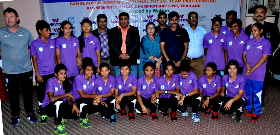 Members of Bangladesh Women's Futsal team with the guest and officials of Bangladesh Football Federation pose for a photo session at the conference room in BFF House on Sunday.