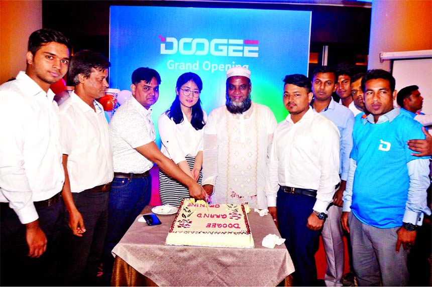 Oli Ullah, Propiter of Al-Ameen and Brothers, inaugurating the Spanish mobile company Doogee at a hotel in the city on Saturday. Doogee brings for models in local merket. Omar Faruque, Managing Director, Arif Rahman, Commercial Manager of the company and