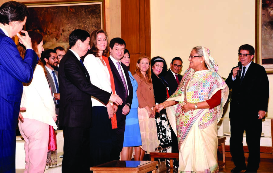 Prime Minister Sheikh Hasina exchanging pleasantries with the delegation of United Nations Security Council at Ganobhaban on Monday. BSS photo