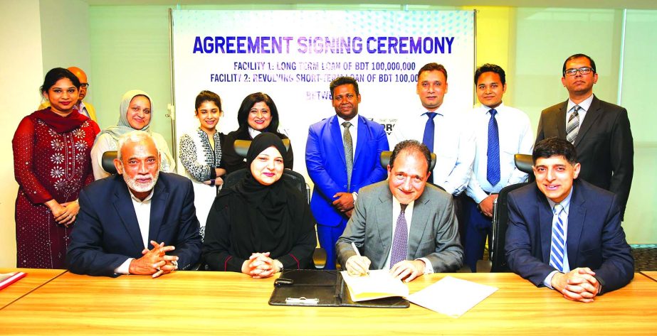 Uzma Chowdhury, Chairman of Property Development Limited and Romesh Elapata, CEO of Lankan Alliance Finance Limited, sign a loan agreement of Tk 20 crores at the financial company in the city recently.