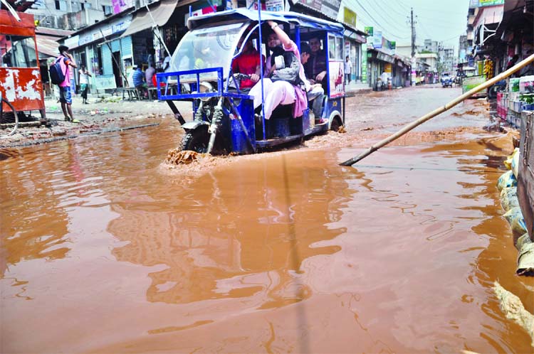 Due to absence of proper drainage system rain waters remain stagnant on roads leaving vehicles stuck for hours together. This photo was taken from Paradogair in Demra on Wednesday.