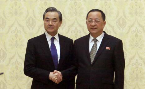 North Korean Foreign Minister Ri Yong Ho poses with Chinese Foreign Minister Wang Yi at the Mansudae Assembly Hall in Pyongyang, North Korea on Wednesday.