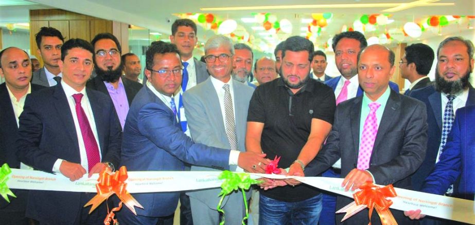 Khwaja Shahriar, Managing Director of LankaBangla Finance Limited, inaugurating its relocated branch at College Road in Madhabdi of Narsingdi on Monday. High officials of the company and local elites were also present.