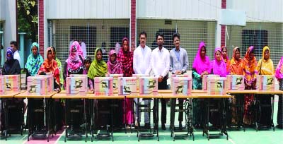 SIRAJGONJ: Sewing machines were distributed among women at a function at Ullapara recently.