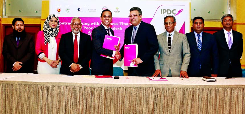 Mominul Islam, Managing Director of IPDC Finance Limited and Buddhika Samarasinghe, Director of Nathan Associates London Limited (an authorized agent of Department for International Development (DFID) for the development of Digital Supply Chain Finance Pl