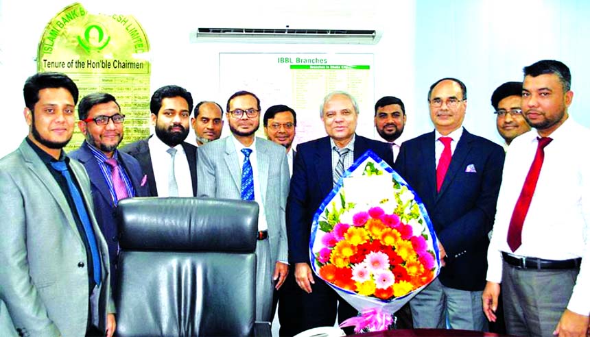 Officers of Islami Bank Foundation led by its Executive Director Md. Golam Hafiz Ahmed, congratulating the newly appointed Chairman of Islami Bank Bangladesh Limited Professor Md. Nazmul Hassan with floral wreath at the bank head office in the city recent