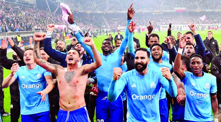 Marseille players celebrate their victory at the end of the Europa League second leg on Thursday.