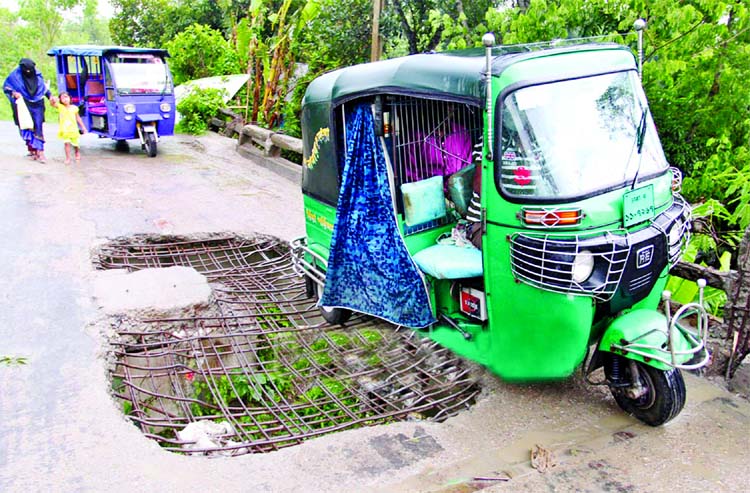 A terribly dilapidated condition of a road in Kolatia area in South Keraniganj. This photo was taken on Friday.