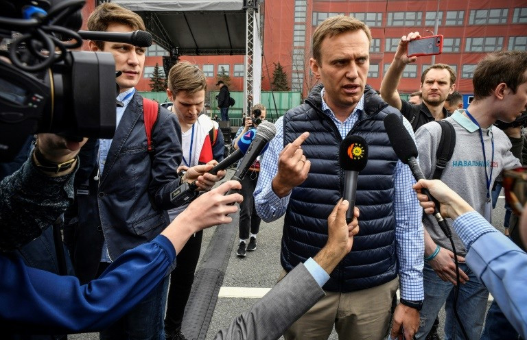 Russian opposition leader Alexei Navalny talks to media during an opposition rally in central Moscow.