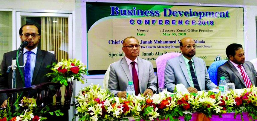 Mohammed Monirul Moula, Managing Director (CC) of Islami Bank Bangladesh Limited, addressing at a Business Development Conference organized by its Jashore Zone at its office on Saturday. Abu Reza Md. Yeahia, DMD, Mizanur Rahman, Head of Jashore Zone and M