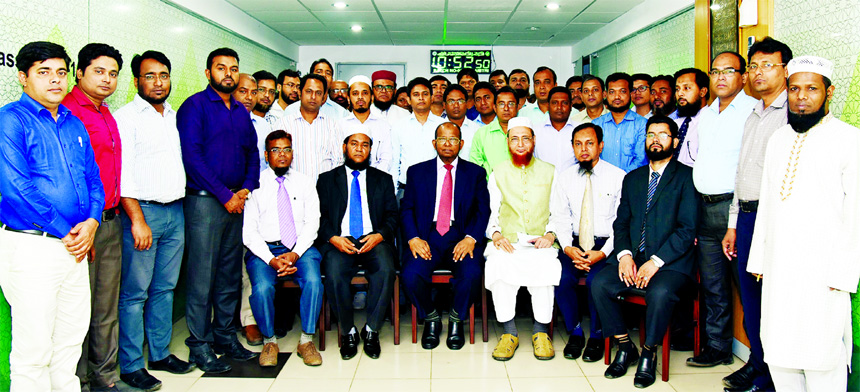 Md. Habibur Rahman, Managing Director of Al-Arafah Islami Bank Limited, poses for a photograph with the participants of a day-long training course on 'Risk Based Internal Audit Software (RBIAS) Implementation' at the bank Training and Research Institute