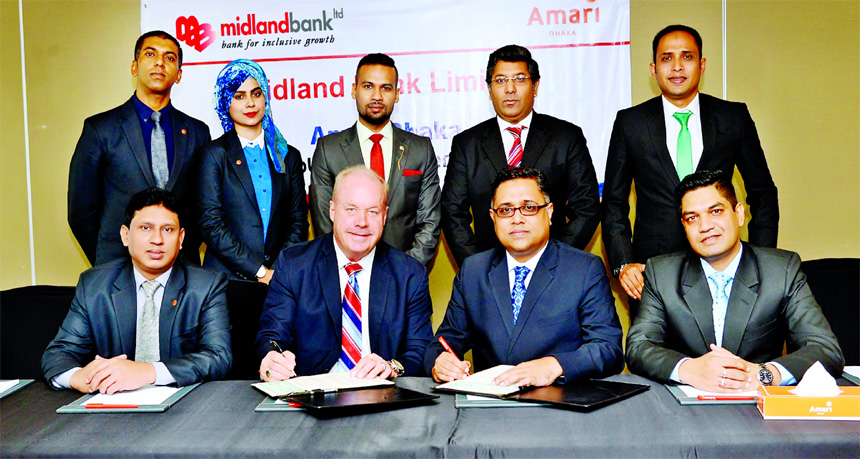 Md. Ridwanul Hoque, Head of Retail Distributions of Midland Bank Limited and Kelly Lewis, General Manager of Hotel Amari Dhaka, exchanging an agreement signing documents at the hotel's premises in the city recently. Under the deal, Visa credit cardholder