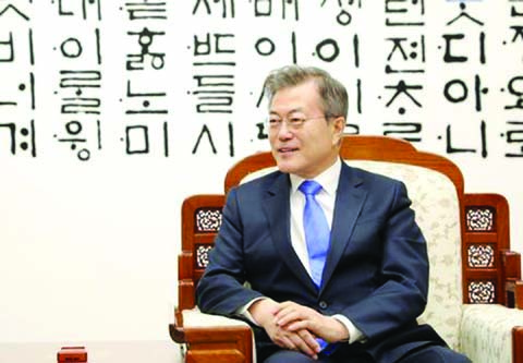 South Korean President Moon Jae-in attends a meeting with North Korean leader Kim Jong Un (not seen) at the Peace House at the truce village of Panmunjom inside the demilitarized zone separating the two Koreas, South Korea