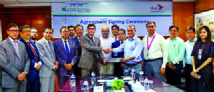 Adil Raihan, Deputy Managing Director of Mercantile Bank Limited and Moinuddin Mohammed Rahgir, Chief Financial Officer of bKash Limited, sign a deal for "Cash Management" services at the Bank's Board Room on Tuesday. Managing Director and CEO of the B