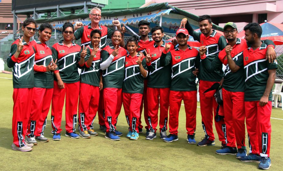 All Bangladeshi finalists of 2nd ISSF celebrate with coach Martin Frederick at Maulana Bhashani National Hockey Stadium on Tuesday.