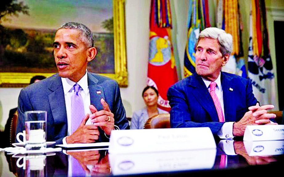 Former President Barack Obama, accompanied by Ex-Secretary of State John Kerry, meets with veterans and Gold Star Mothers to discuss the Iran Nuclear deal in the Roosevelt Room at the White House in Washington.