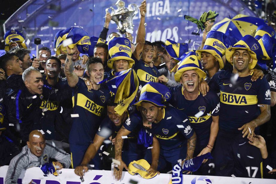 Boca Juniors' players celebrate winning the local soccer tournament after defeating Gimnasia y Esgrima, in Buenos Aires, Argentina on Wednesday.
