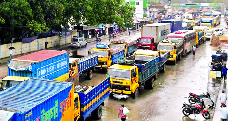 Several hundred vehicles got stuck in a 25 Km long tailback on Dhaka-Chattogram Highway stretching from Chouddagram to Fatehpur rail crossing in Feni, causing immense sufferings to commuters. This photo was taken on Friday.