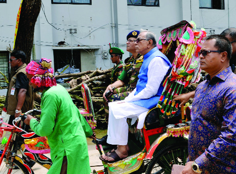 KISHOREGANJ: President Md Abdul Hamid visiting haor areas by rickshaw in Kishoreganj on Friday.