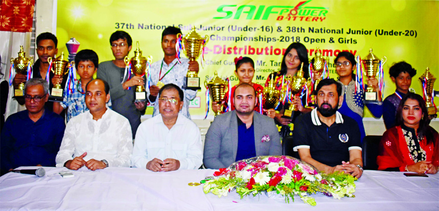 Prize winners of the SAIF POWER BATTERY 38th National Junior (Under-20) Chess Championships-2018 pose for photo with their trophies and guests at Bangladesh Chess Federation hall-room in 2nd floor of National Sports Council old building on Saturday.