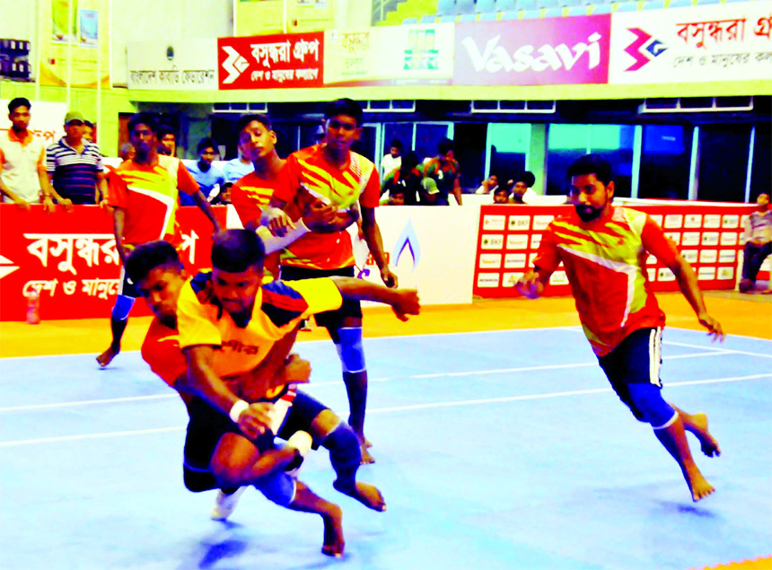 A moment of the match of the IGP Cup National Youth Kabaddi Competition between Jashore District team and Gopalganj District team at the Shaheed Tajuddin Ahmed Indoor Stadium on Saturday.
