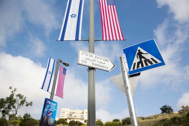 A road sign leading to the U.S. Embassy is seen ahead the official opening in Jerusalem on Sunday.