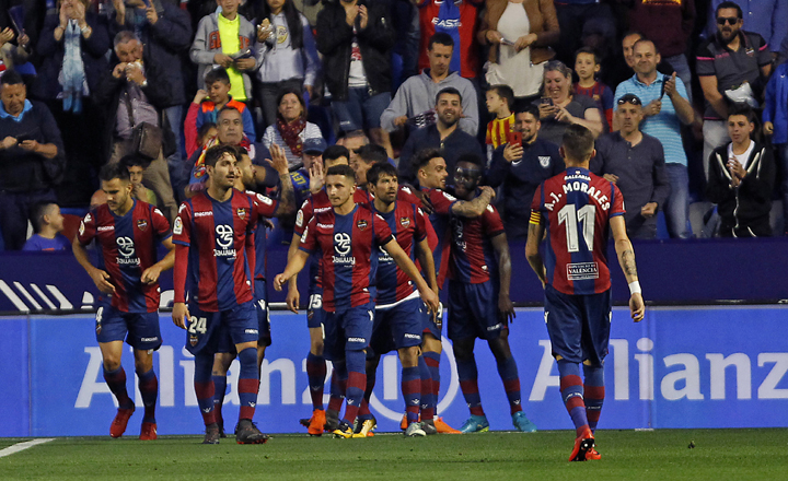 Levante's Emmanuel Boateng, second right, is congratulated by teammates after scoring his second goal against Barcelona during the Spanish La Liga soccer match between Levante and Barcelona at the Ciutat de Valencia stadium in Valencia, Spain on Sunday.