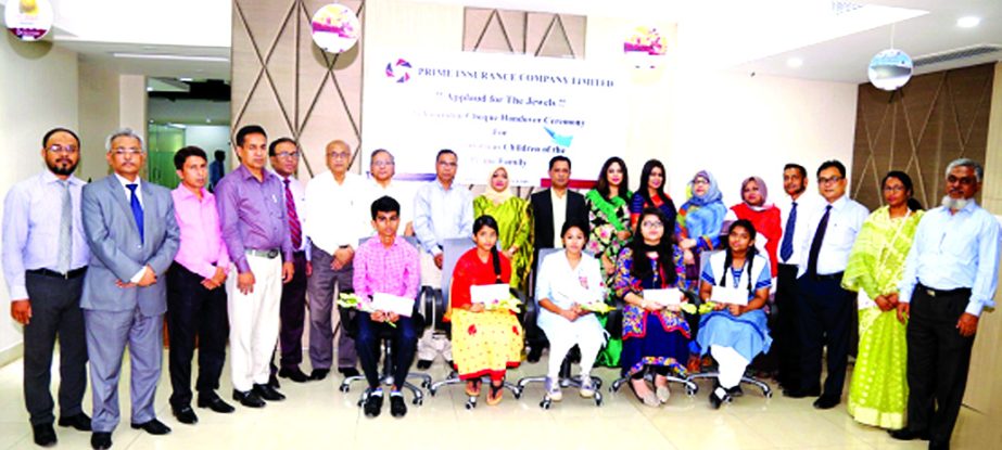 Md. Zakiullah Shahid, Chairman of Prime Insurance Company Limited, poses with the participants of a scholarship cheques handing ceremony who got GPA-5 (Golden) in their respective PSCJSCSSCHSCDakhilAlim'O' Level'A' level exams held in the year