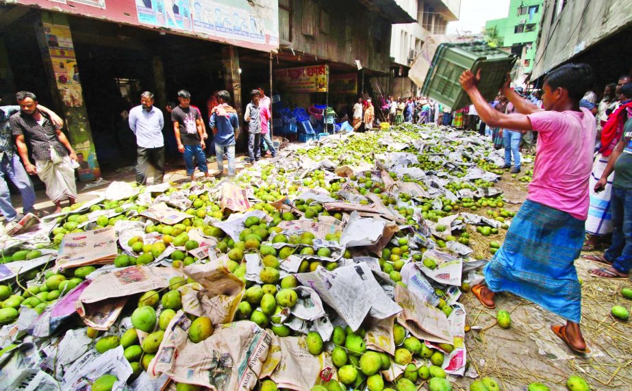 AIMS AT ADULTERATED-FREE FOOD: BSTI and RAB mobile team in a joint drive destroyed about four hundred maunds of Chemical-tainted mangoes in city's Kawran Bazar area on Tuesday.