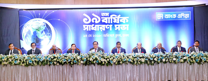 A. Rouf Chowdhury, Chairman of Bank Asia, presiding over its 19th Annual General Meeting of the bank at Officers Club in city on Monday. Managing Director Md. Arfan Ali and Company Secretary Md. Kamrul Hasan were also present. The AGM approves 12.5pc stoc