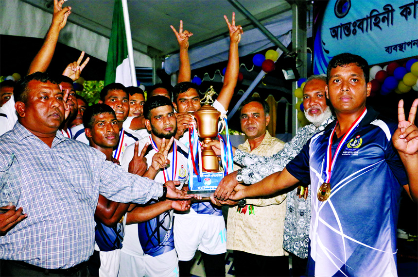 Assistant Chief of Naval Staff Rear Admiral M Shaheen Iqbal handing over the trophy to Bangladesh Navy team, which emerged as the champions of the Inter-Service Kabaddi Competition at the Kabaddi Ground in Navy Colony, Mirpur on Wednesday.