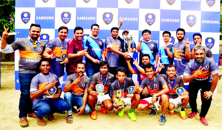 Members of Smart Technologies, the champions of the Samsung Super Cup Football Tournament pose for a photo session at Banani Chairman Bari Field in the city recently. Smart Technologies beat Electra International by 4-2 goals in the final.