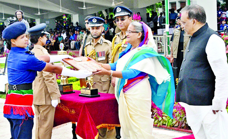 Prime Minister Sheikh Hasina presenting 'Best Academic Medal' to apprentice Assistant Police Super Asma Akhter Sonia at the concluding ceremony of a training for Apprentice Assistant Police Supers of the 35th BCS batch at Sarda Police Academy in Rajsha