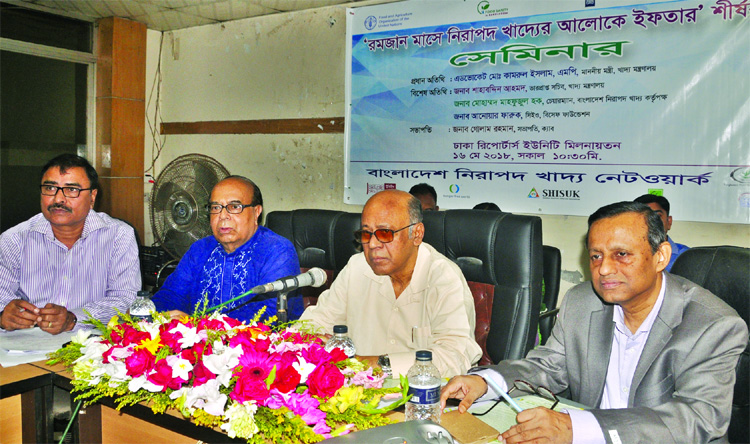 Food Minister Qamrul Islam speaking at a seminar on 'Iftar in Light of Safe Food in the Month of Ramzan' organised by Bangladesh Safe Food Network in DRU auditorium on Wednesday.