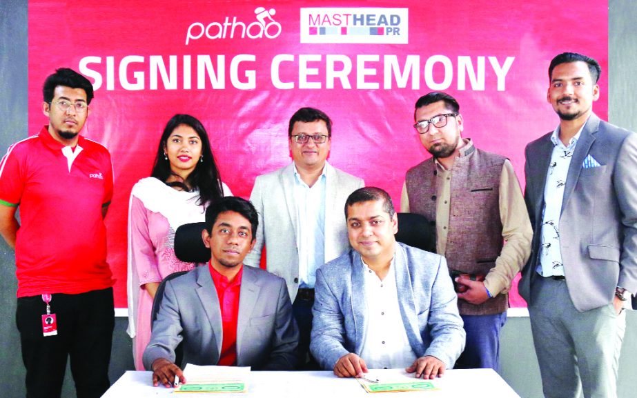 Hussain M Elius, CEO of Pathao Bangladesh, a ride sharing platform and Ziauddin Adil, Managing Director of Masthead PR, sign an agreement for corporate profiling, brand profiling and event management at Pathao head office in the city recently. Top officia