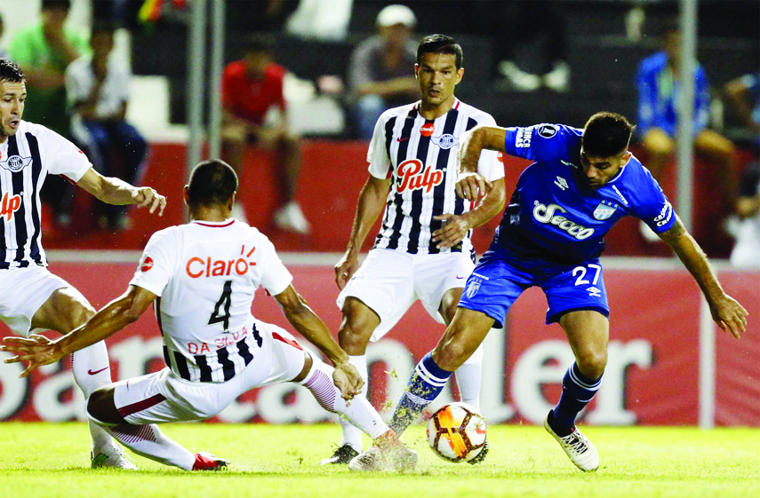 Striker Leandro Nicolas Diaz of Argentina's Atletico Tucuman fights for the ball with defender Paulo Da Silva of Paraguay's Libertad during a Copa Libertadores soccer match, in Asuncion, Paraguay on Thursday.