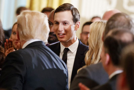 White House senior adviser Jared Kushner shakes hands with President Donald Trump during an event on prison reform in the East Room of the White House on Friday.