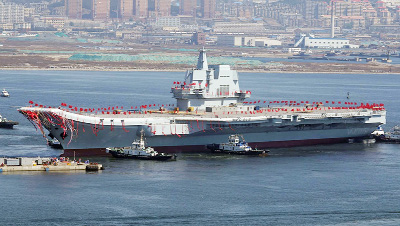 China's first indigenously-built aircraft carrier on Friday successfully completed its maiden sea trial