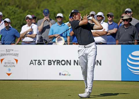 Jordan Spieth watches his tee shot on the first hole during the second round of the AT&T Byron Nelson golf tournament at Trinity Forest Golf Club in Dallas on Friday.