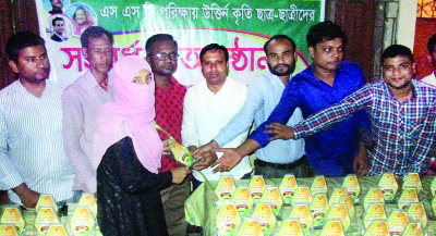 SYLHET: Emrul Hasan, formal General Secretary, Sylhet Chhatra League giving crests among the meritorious students who passed SSC this year organised by Moglabazar Chhatra League as Chief Guest recently.