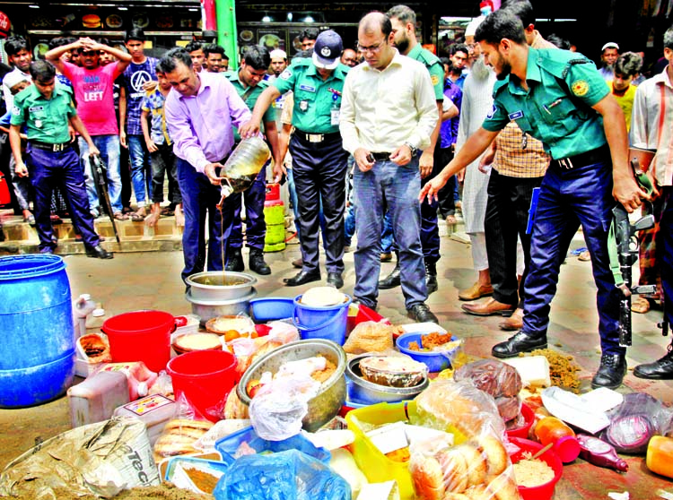 DMP Mobile Court conducted drive in city's 9 New Market 'Fast Food' Pizza Fried Rice Shops, penalises Taka four lakh 30 thousand for preparing rotten food. This photo was taken on Sunday.