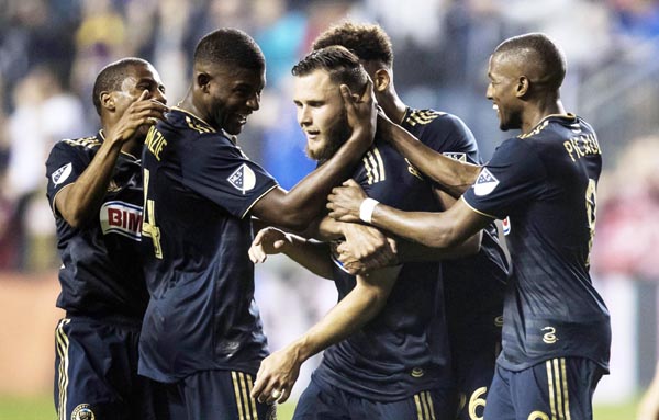 Philadelphia Union's Keegan Rosenberry (center) celebrates his goal with teammates during the second half of an MLS soccer match against Real Salt Lake on Saturday in Chester, Pa. The Union won 4-1.
