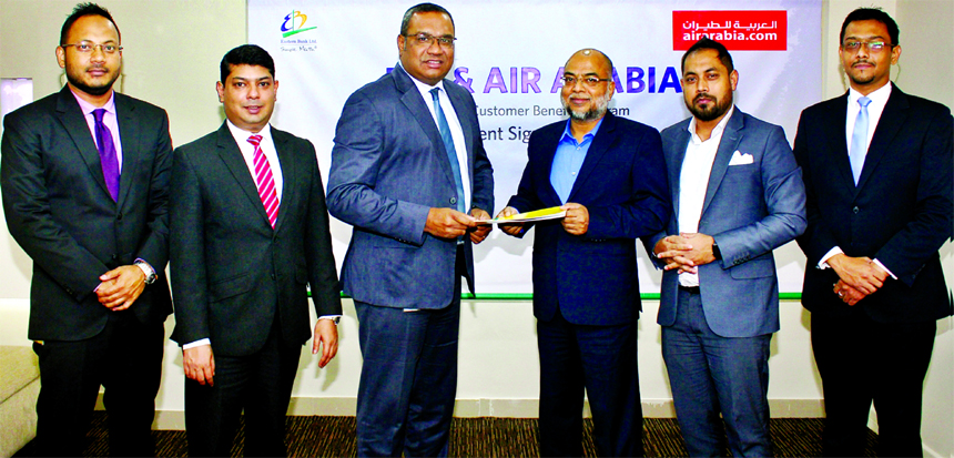 M. Khorshed Anowar, Head of Retail Banking of Eastern Bank Ltd and Md. Abdur Rahim, Director, One World Aviation Limited, General Sales Agent (GSA) of Air Arabia in Bangladesh, exchanging documents after signing an agreement in Dhaka recently. Under the a