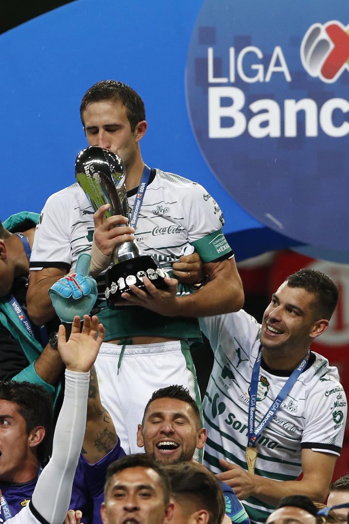 Santos team captain Carlos Izquierdoz kisses the trophy after winning the Mexican soccer league championship against Toluca at Nemesio Diez stadium in Toluca, Mexico on Sunday.