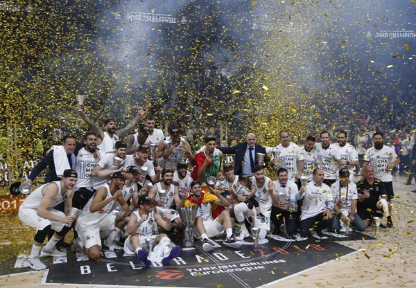 Real Madrid players celebrate as they win the Final Four Euroleague final basketball match between Real Madrid and Fenerbahce Istanbul in Belgrade, Serbia on Sunday.