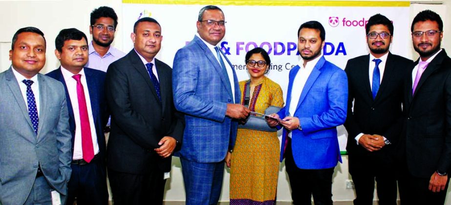 M.Khorshed Anowar, Head of Retail Banking of Eastern Bank Limited and Zubair B A Siddiky, Co-founder and Managing Director of Foodpanda, exchanging an agreement signing documents at the bank head office in the city recently. Under the deal, Customers of F