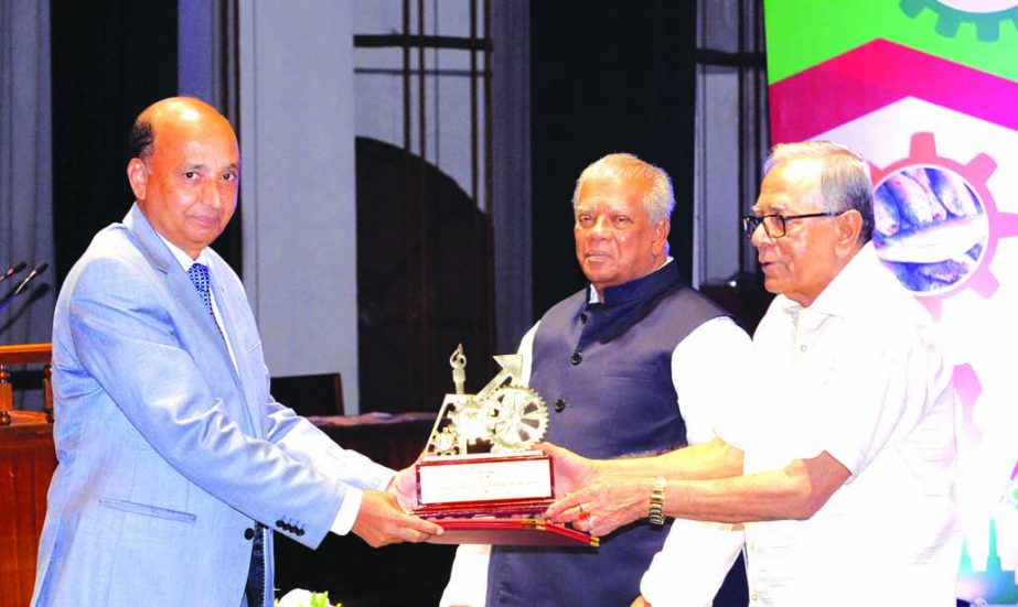 Hafizur Rahman, Chairman of Runner Group, receiving the 'President's Industrial Development Award-2016' from the President Md Abdul Hamid at Osmani Memorial Auditorium on Tuesday.