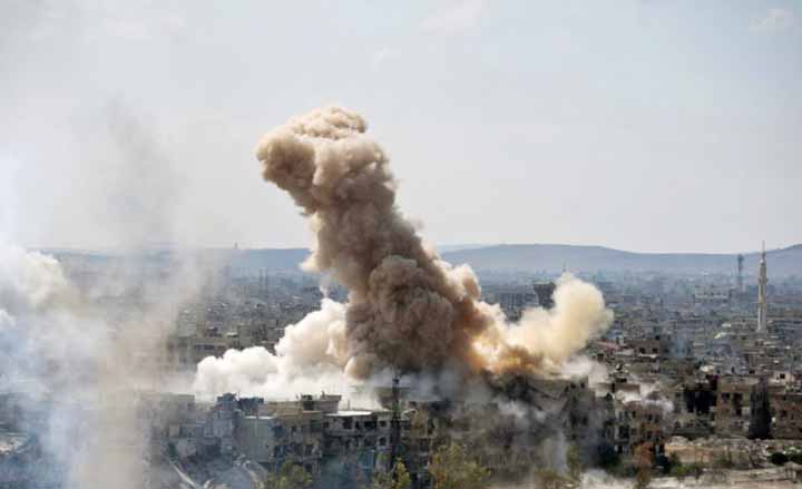 Smoke rises after Syrian government airstrikes and shelling hit in Hajar al-Aswad neighborhood held by Islamic State militants, southern Damascus, Syria.