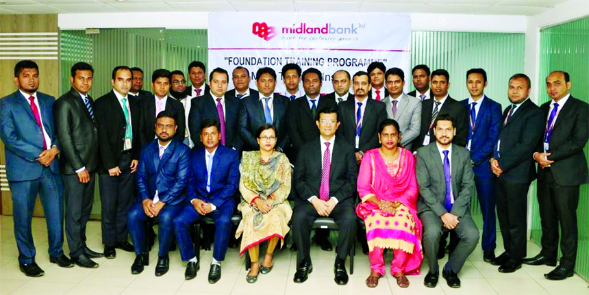 Md. Ahsan-uz Zaman, Managing Director of Midland Bank Limited, poses with the participants of 5-day long Foundation Training Course for its officials at its Training Institute in the city recently. Officials from Branches and Head Office of the bank were